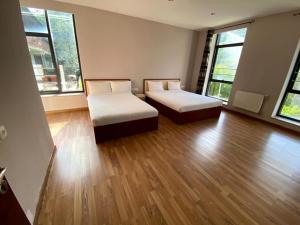 Postel nebo postele na pokoji v ubytování Villadzor Apart Hotel