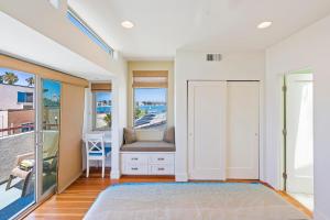a living room with a door and a window at Bay View Beach House - Your Coastal Retreat in San Diego