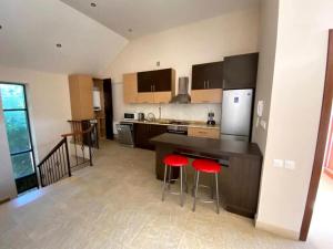Kuchyň nebo kuchyňský kout v ubytování Villadzor Apart Hotel