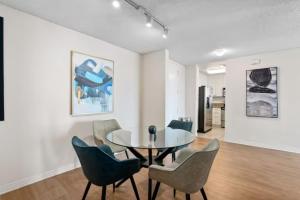 a dining room with a glass table and chairs at Stunning Ocean View 1BR Venice Beach Marina DelRey in Los Angeles