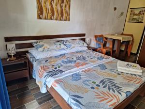 A bed or beds in a room at Genevieve Guest House