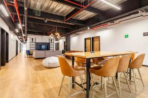 a large room with a table and chairs at Mariano Escobedo 48 in Mexico City +6 photos