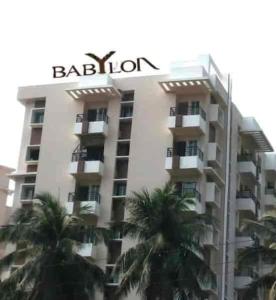 um edifício com um sinal em cima em Babylon - Luxurious yet Homely Facility em Guwahati