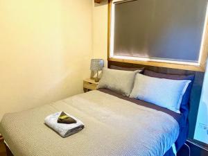 Voodi või voodid majutusasutuse Cooinda Holiday Village Cabins toas