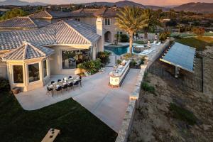an aerial view of a house with a swimming pool at Sangiovese By AvantStay Spectacular Estate w Pool Hot Tub Putting Green in Temecula