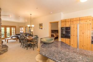 a kitchen with a living room and a dining room at Westermere 311 - 2 by AvantStay Just Steps From Ski Area w Great Views in Telluride