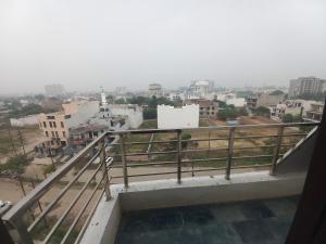 a view of a city from a balcony at Paradise Homes in Agra