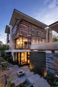 a large house with a lot of windows at S-Villa plus Water Feature & Zen Garden in Vancouver