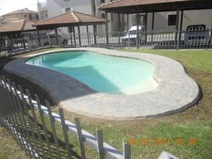 The swimming pool at or close to Santini Lace Self Catering Unit