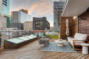 a rooftop deck with a view of a city at Paramount Place by AvantStay 4 Story Apartment in Heart of Austin w Movie Theatre in Austin