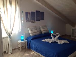 Postel nebo postele na pokoji v ubytování Spegni La Luce b&b