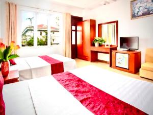 Postel nebo postele na pokoji v ubytování Vera Hotel Hà Nội
