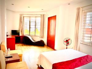 Postel nebo postele na pokoji v ubytování Vera Hotel Hà Nội
