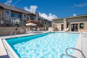 a swimming pool in the backyard of a house at Chicane by AvantStay Close to the Ski Slopes in this Majestic Home in Park City in Park City