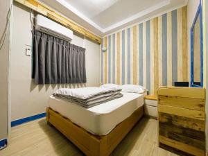 Postel nebo postele na pokoji v ubytování 東澳 露境東岳 露境公社背包客棧