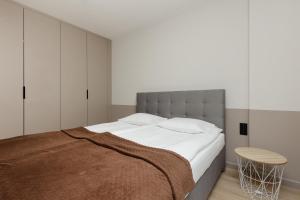 Postelja oz. postelje v sobi nastanitve Aparthotel Mokotów Business Center by Renters