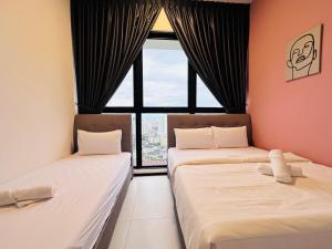 מיטה או מיטות בחדר ב-Urban Suites Homestay
