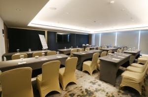 a conference room with tables and chairs in it at Java Paragon Hotel & Residences in Surabaya +79 photos