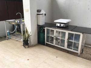 a kitchen with a sink and a counter with a sink at Bangpo Village Tiny Country Beach House in Koh Samui  +43 photos