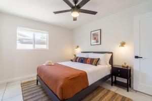 a bedroom with a bed and a ceiling fan at Rosario by AvantStay10mins to Old Town Scottsdale w Hot Tub in Scottsdale