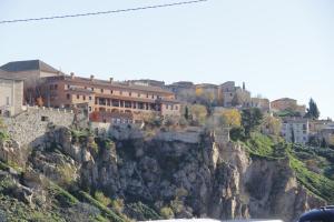 a group of buildings on top of a mountain at The Bridge house of Toledo in Toledo
