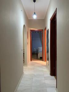 a hallway with a hallway leading to a bedroom at Κατοικία με πανοραμική θέα in Nikópolis
