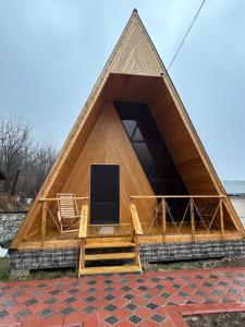 a pyramid shaped house with a flat screen tv in it at Դիլիջան Գոլդ Ռեզորթ Dilijan Gold Resort Дилжан Голд Резорт in Dilijan +5 photos