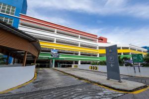 a building with a sign in front of it at Zecon Hotel in Kuala Lumpur