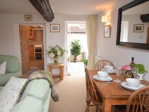 a living room with a table and a dining room at 2 bed in Wells 52STT in Wells