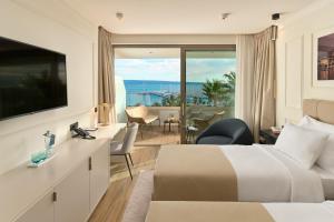 a hotel room with a bed and a view of the ocean at Mirari Boutique Hotel in Split