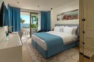 a hotel room with a bed and a view of the ocean at Mirari Boutique Hotel in Split
