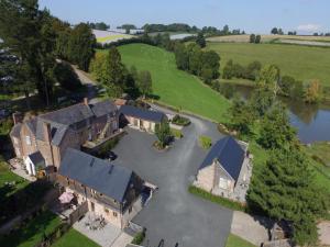an aerial view of a large house with a lake at 3 Bed in Leominster 50507 in Pencombe