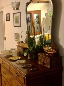 a dresser with a mirror on top of it at Garibaldi suite in Venice +11 photos