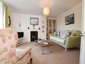 a living room with a couch and a table at 1 bed in Brixham BX046 in Brixham