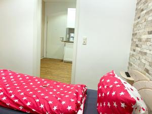 Postel nebo postele na pokoji v ubytování Ferienwohnungen Arp "Kleine Gärtnerei" mit Parkplatz
