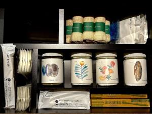 a shelf with jars of food on it at e-ma ISHIGAKIJIMA TABISHIKA in Ishigaki Island