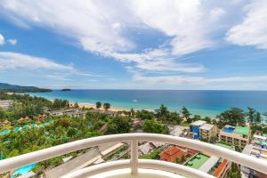 a view of the ocean from the balcony of a resort at Waterfront Suites Phuket by Centara NEW in Phuket Town