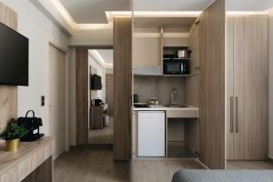 a small kitchen with a sink and a counter at Vialmar Premium Apartments in Rio