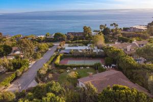 an aerial view of a house with a tennis court at Dume Point by AvantStay Tennis Pool in Malibu in Malibu