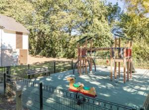 a playground with a toy duck on a slide at Maison 6 personnes avec terrasse, piscines et sauna in Pornichet