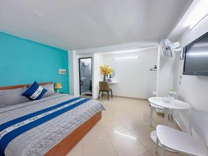 Postel nebo postele na pokoji v ubytování Thắng Hà Hotel