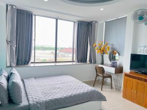TV a/nebo společenská místnost v ubytování Thắng Hà Hotel