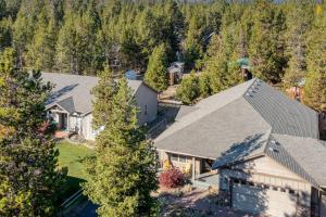 an aerial view of a house with trees at Black Bear Cabin by AvantStay Modern Bend Escape in Bend