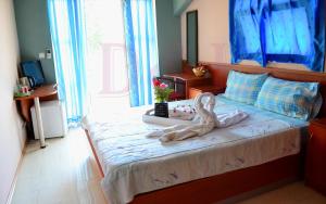 a bedroom with a bed with a stuffed animal on it at Villa D&L in Ohrid