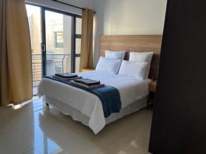 Ένα ή περισσότερα κρεβάτια σε δωμάτιο στο Jermaine’s apartment in Umhlanga