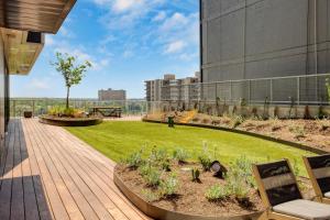 a garden on the roof of a building at Majestic by AvantStay Brand New Condo in Austin w Amazing Amenities in Austin