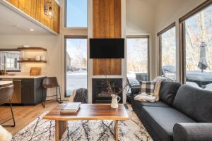 a living room with a couch and a fireplace at Quicksilver by AvantStay Park City Town House in Great Location in Park City