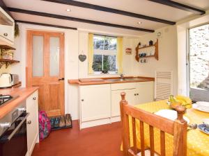 a small kitchen with a table and a window at 1 Bed in Wirksworth 78309 in Wirksworth