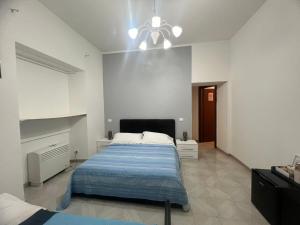 Letto o letti in una camera di Camere Andrea