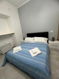 Letto o letti in una camera di Camere Andrea